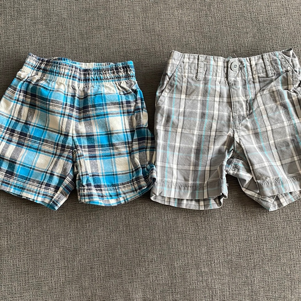 Two pairs of blue plaid shorts